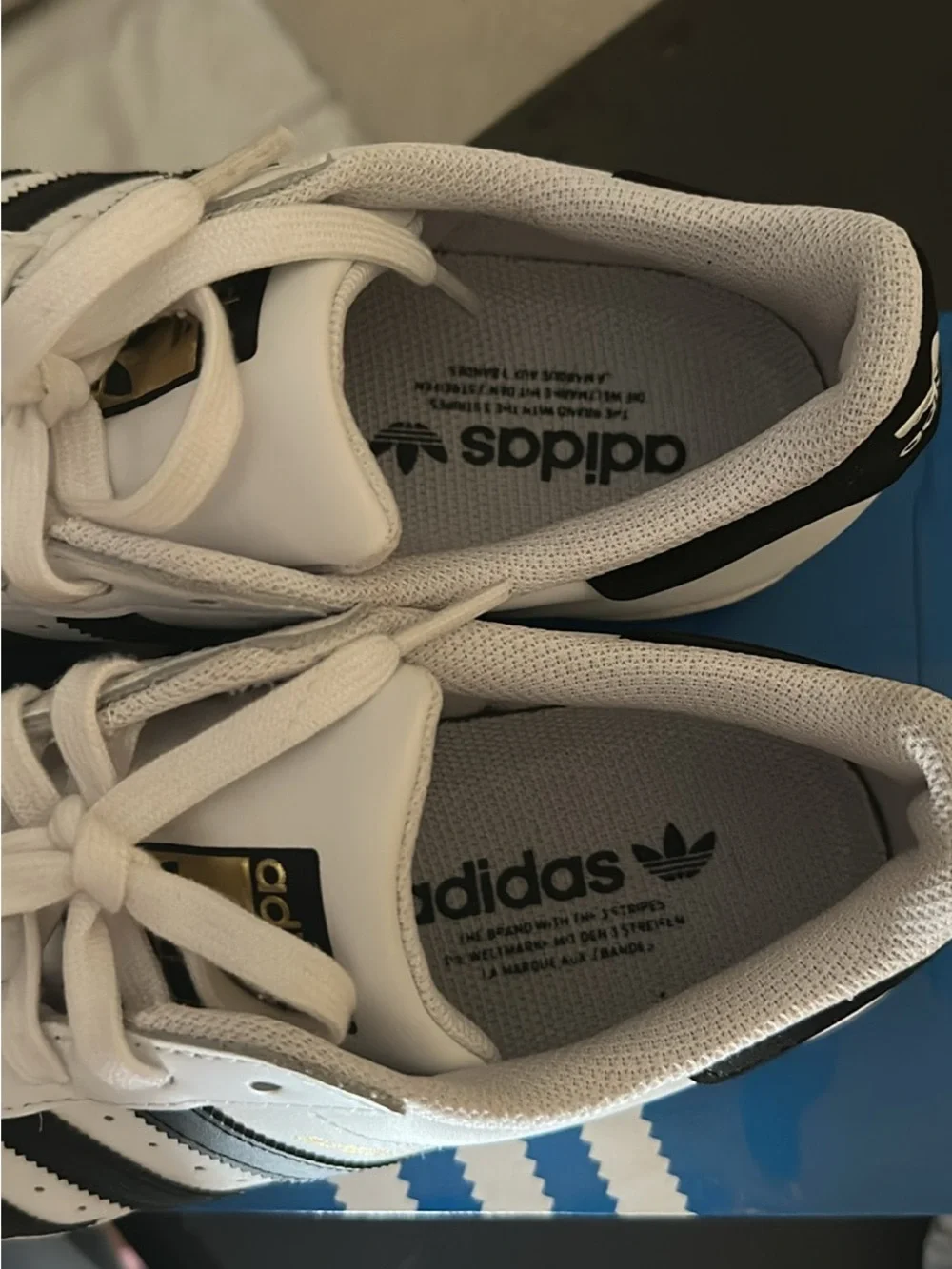 adidas Superstar white and black sneakers